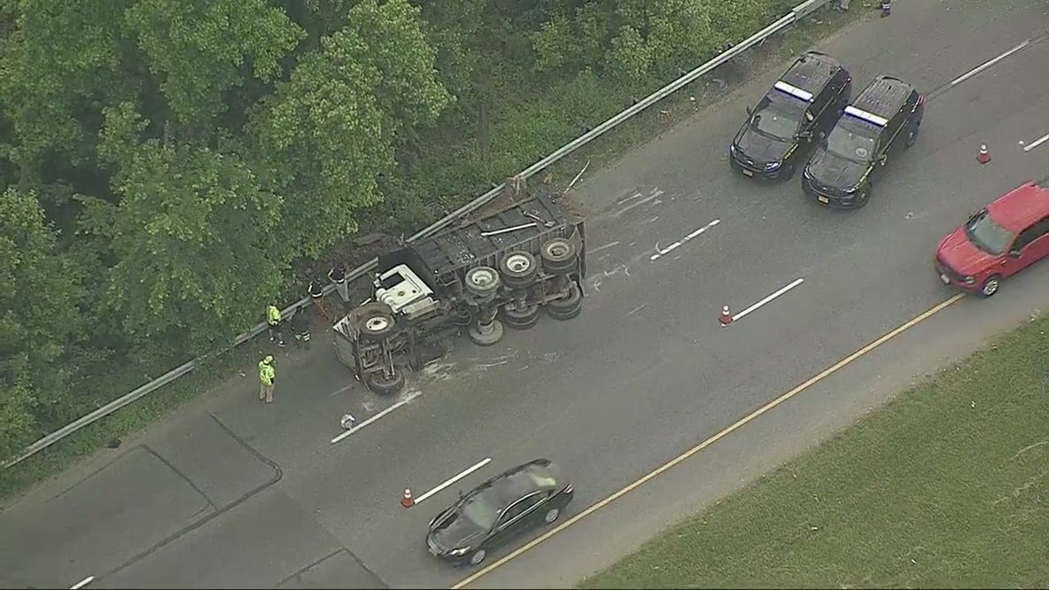 Dump truck flips on side, loses load in Upper Marlboro
